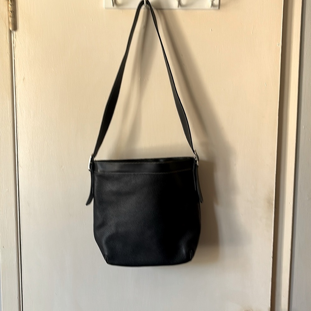 Roots leather crossbody bag.